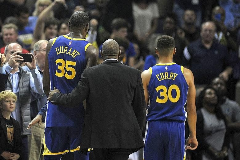 Golden State Warriors forward Kevin Durant and guard Stephen Curry are ejected during the second half of their game against the Memphis Grizzlies. Memphis defeated Golden State 111-101 at the FedExForum.