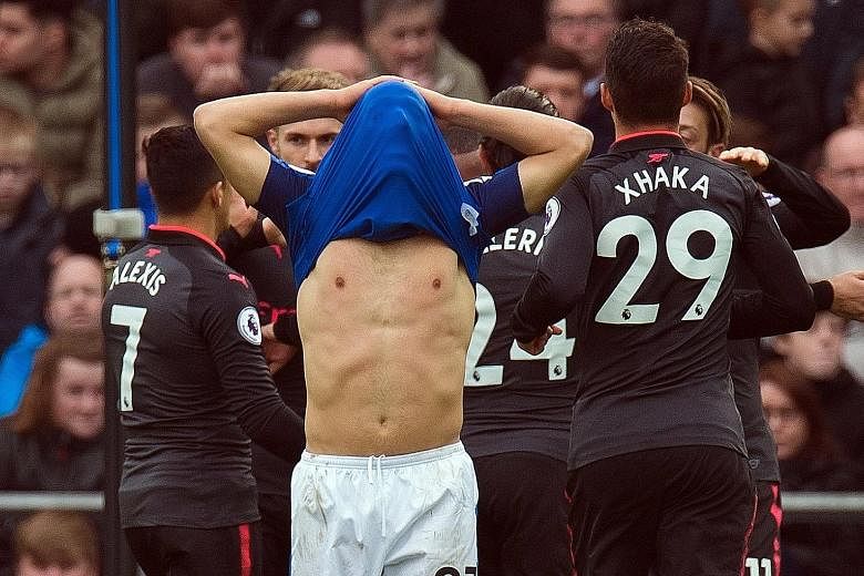 Everton's Nikola Vlasic is a picture of gloom after Alexandre Lacazette put Arsenal 3-1 up in their English Premier League match at Goodison Park yesterday. The vultures are now circling over Ronald Koeman's head as bookmakers have him leading the "s