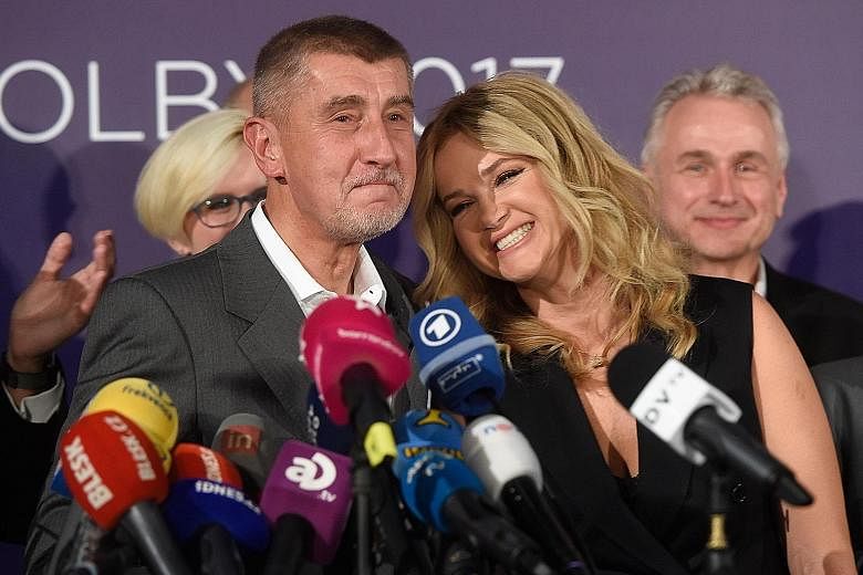 Billionaire Andrej Babis, leader of the ANO party, and his wife Monika at the party's headquarters in Prague last Saturday after the country's parliamentary elections. As the second-richest Czech, Mr Babis has drawn comparisons to US President Donald