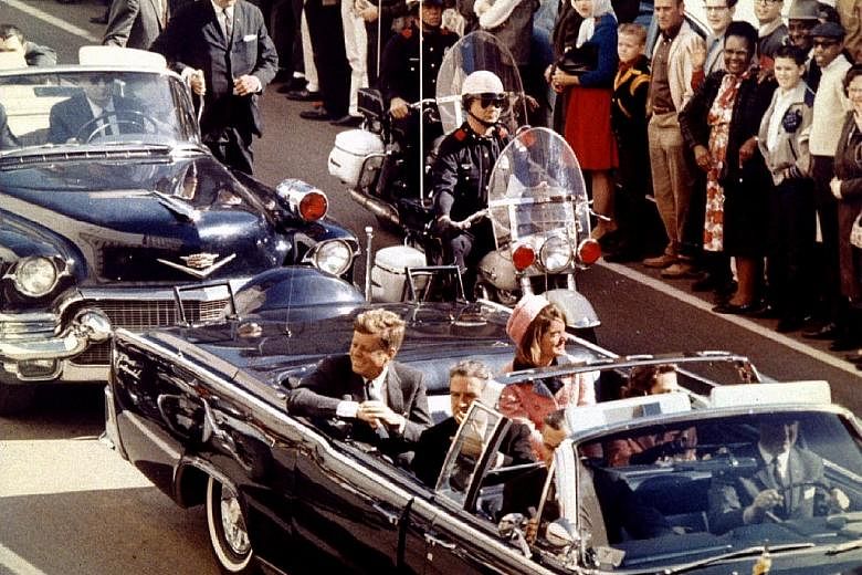 President John F. Kennedy and his wife Jacqueline Kennedy riding through Dallas just moments before his assassination on Nov 22, 1963.