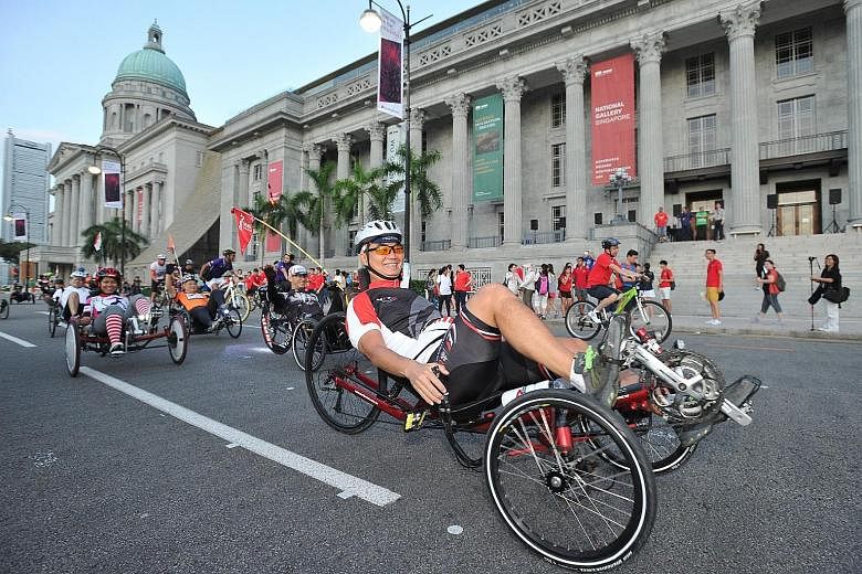 Cyclists in front of the National Gallery Singapore on Car-Free Sunday SG on Feb 28 last year. Thousands of joggers, cyclists and families have participated in the initiative since it was first introduced last year.