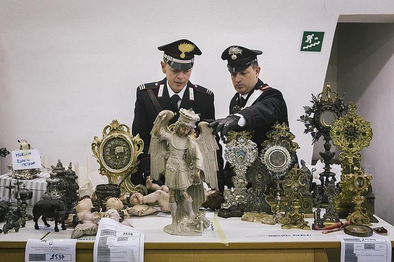 A stolen 16th-century statue of the archangel Michael and other religious artefacts were recovered after months of investigations.