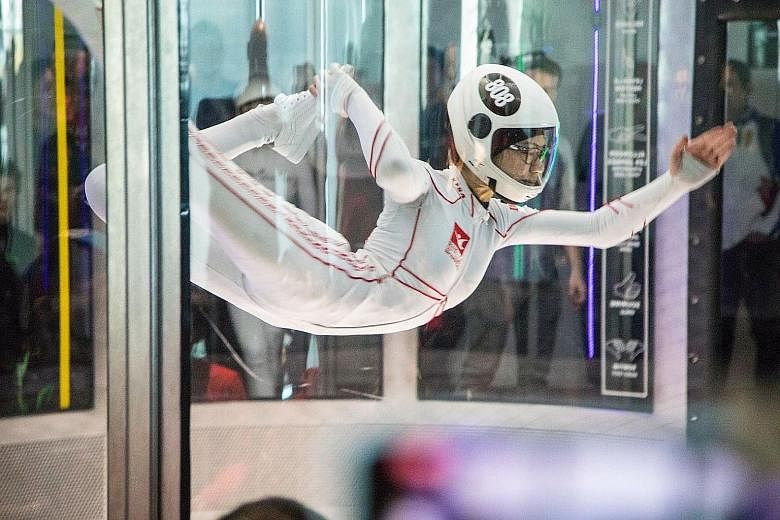 Kyra Poh soaring at last week's World Indoor Skydiving Championship in Canada, where she won an individual gold and teamed up with Choo Yi Xuan for a silver.