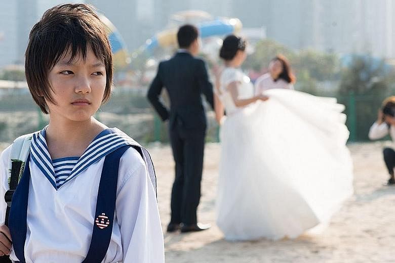 Angels Wear White, by Vivian Qu (above) and starring teenage actress Zhou Meijun (left), opens the Singapore International Film Festival on Nov 23.