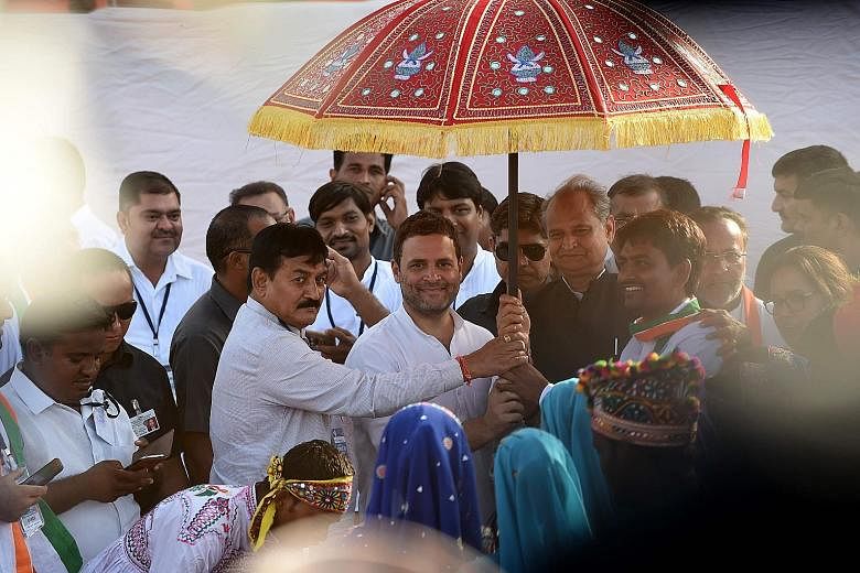 Congress vice-president Rahul Gandhi (centre) at a rally in Gujarat on Monday. He is traversing the western state where Prime Minister Narendra Modi made his name, to fire up his party workers.
