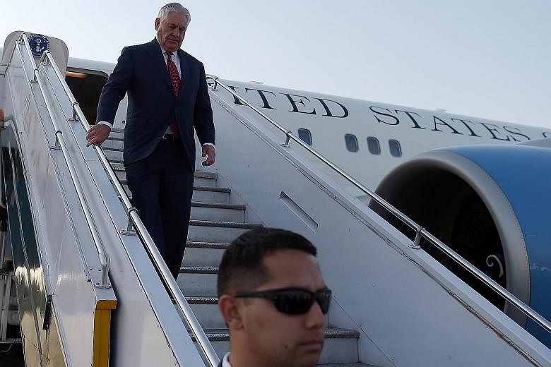 US Secretary of State Rex Tillerson disembarking from his plane at the Nur Khan military airbase in Pakistan's garrison city of Rawalpindi yesterday. He was quietly greeted by a mid-level Pakistani Foreign Office official in a welcome devoid of the p