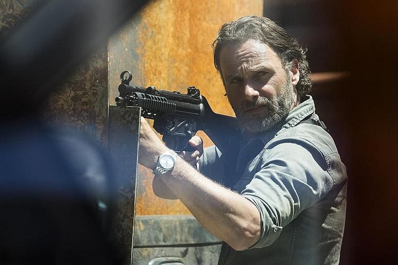 Actor Andrew Lincoln (left) stars in the eighth season of the drama series, The Walking Dead.