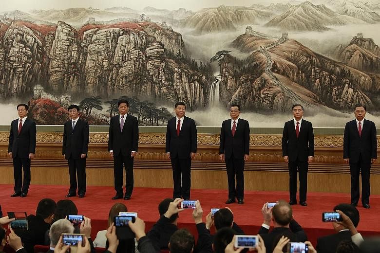 Members of the Chinese Communist Party's new seven-member Politburo Standing Committee - (from left) Mr Han Zheng, Mr Wang Huning, Mr Li Zhanshu, President Xi Jinping, Premier Li Keqiang, Mr Wang Yang and Mr Zhao Leji - were unveiled yesterday at a p