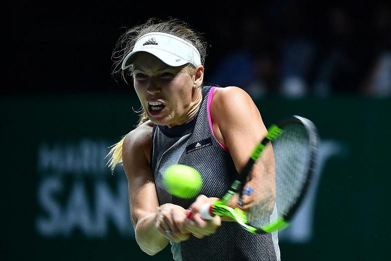 World No. 6 Caroline Wozniacki leaving world No. 1 Simona Halep of Romania with no answer to her power play and accurate ground strokes in their Red Group tie. The Dane, who has been in imperious form in her two WTA Finals Singapore matches, advances