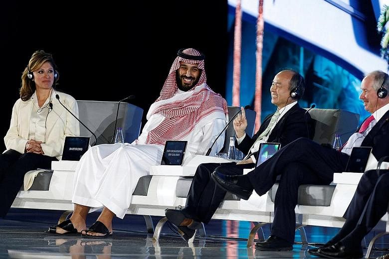 Saudi Crown Prince Mohammed bin Salman and SoftBank Group chief executive Masayoshi Son at the Future Investment Initiative conference in Riyadh on Tuesday. The Prince's declaration of a new reality for the kingdom is the most direct attack by a Saud