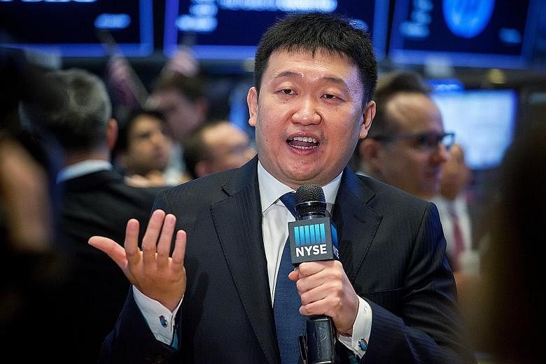 Sea's signage displayed at the New York Stock Exchange during its initial public offering last Friday. The firm was originally founded by Mr Forrest Li (above) as an online gaming company in 2009.