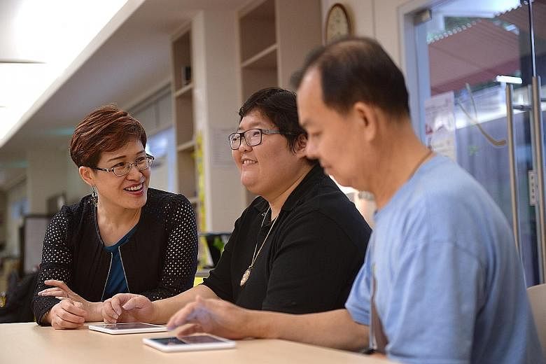 Dr Catherine Dong (far left), who designed the Stroke Support Station's brain health and memory training programme, with stroke survivors Denise Hu, 32, and Liew Teck Chye, 64, at the Enabling Village in Lengkok Bahru.