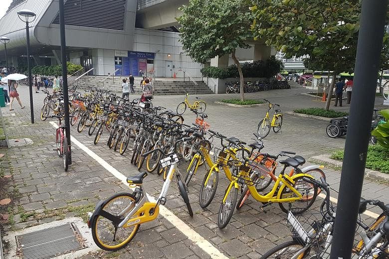 Shared bicycles parked at and around designated bicycle parking zones outside the Punggol MRT station. The various bike-sharing firms are ramping up the use of geofencing.