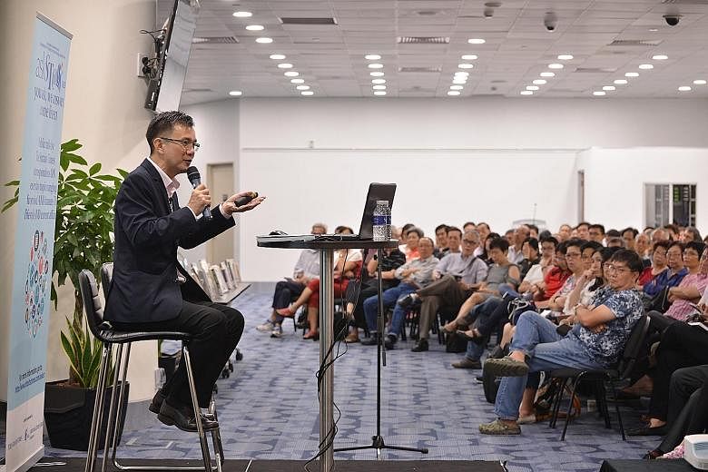 Senior correspondent Goh Eng Yeow addressing the audience yesterday in the fourth instalment of the askST@NLB series. The crowd of 420 was the largest so far in the series.