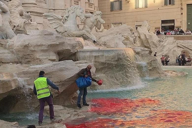 The waters of Rome's Trevi Fountain, one of Italy's top tourist attractions, turned red on Thursday after a man dumped dye into the main pool. Police detained the man, a statement from the mayor's office said, as city officials assessed if there had 