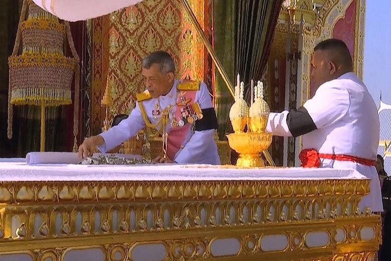 Thai King Maha Vajiralongkorn taking part in a ceremony where he selected relics from the ashes of his father, the late Thai king Bhumibol Adulyadej, at the Royal Crematorium in Bangkok.