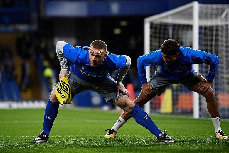 Everton forwards Wayne Rooney and Dominic Calvert-Lewin warming up before their League Cup tie against Chelsea on Wednesday. Caretaker boss David Unsworth has stated that his starting line-up at Leicester today will not be dictated by price tags.