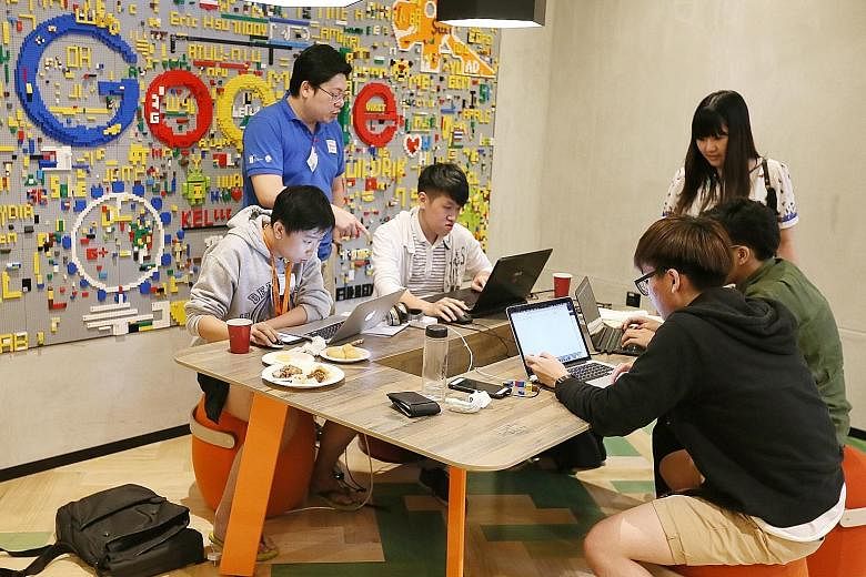 Tertiary students working to come up with ideas to improve the fact-checking process at a hackathon earlier this month, held at the Google Asia-Pacific office in Pasir Panjang.