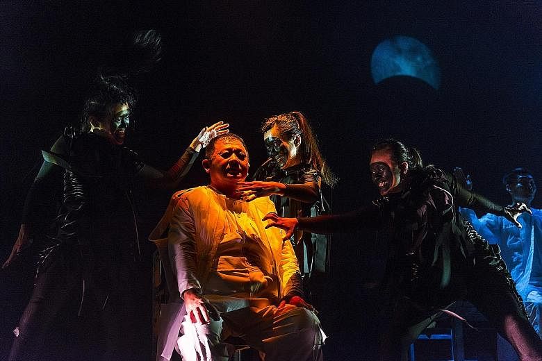 Actor Johnny Ng (in white) is surrounded by three phantoms played by (from left) Myra Loke, Jo Kwek and Jasmine Xie in The Spirits Play.