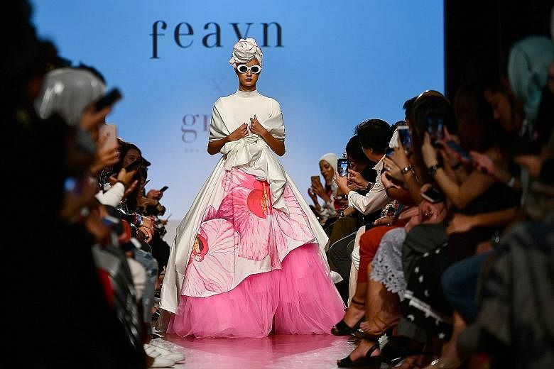 Taiwan-born designer Jason Wu's runway show (above) at Singapore Fashion Week was held at the National Gallery Singapore's Supreme Court Terrace. Outfits by Singapore label Feayn (top) and Indonesian designer Dian Pelangi (above) were also featured.
