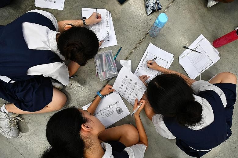 PLMGS students hard at work writing coded messages in school last Monday. They were learning cryptology - the art of encrypting messages so that only the intended recipients can decipher and read them.