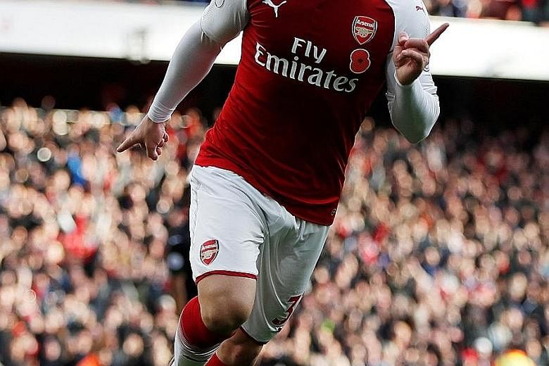 Sead Kolasinac celebrating his equaliser in Arsenal's 2-1 win over Swansea on Saturday. The Bosnian left wing-back arrived in the summer on a free transfer from German club Schalke and has made an impact.