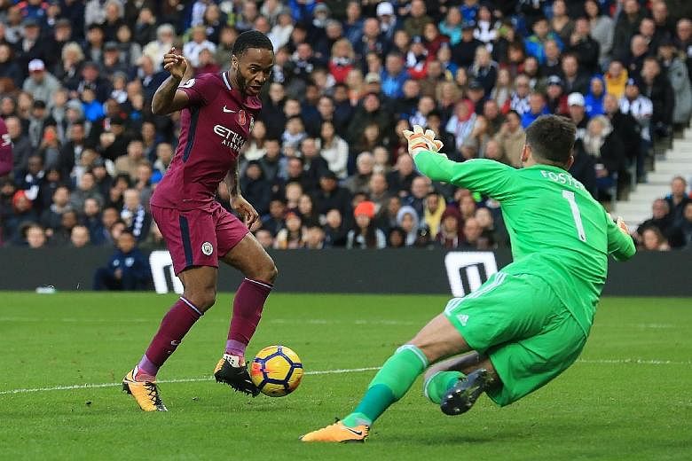 Manchester City winger Raheem Sterling slotting past West Brom 'keeper Ben Foster at The Hawthorns for their third goal on Saturday. The table-toppers have been in imperious form since the start of the season, garnering 28 points out of a possible 30