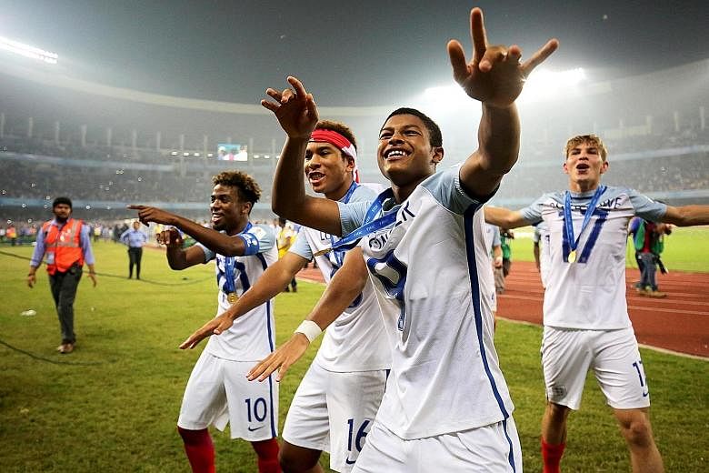 England's players celebrating after their Fifa Under-17 World Cup victory over Spain at Salt Lake Stadium in Kolkata on Saturday. After years of underachievement at senior level, successes at age-group tournaments show that youth development plans ar