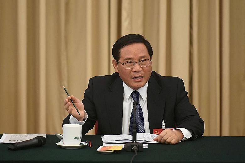 Mr Li Qiang (left), the former Jiangsu party boss, replaces Mr Han Zheng, who joined the elite PSC last week.