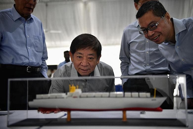 Mr Khaw Boon Wan with managing director of Singapore Terminals 1, Mr Cheang Chee Kit, viewing a 3D printed ship.