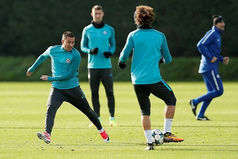 From left: Chelsea's Eden Hazard, Gary Cahill and David Luiz during training. The team face Roma away in their bid to qualify for the Champions League knockout stages before hosting Manchester United in a crack Premier League tie at the weekend.