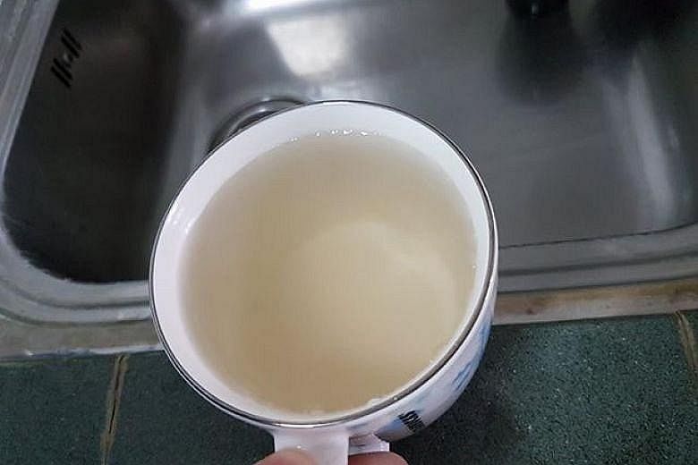 Above: Some households in Choa Chu Kang received brownish water after a pipe burst, disrupting water supply on Sunday. A town council spokesman said this was due to natural sediments in the water tank and flushing of the tank and pipes had been condu