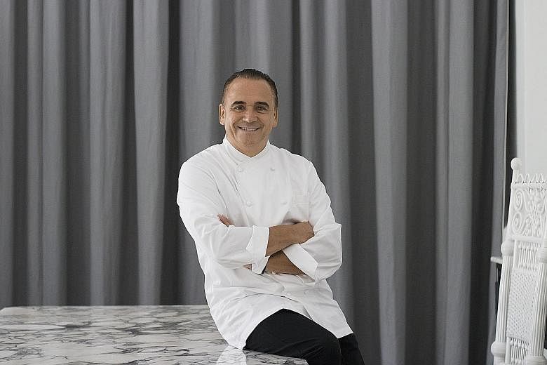 Jean-Georges in New York by celebrity chef Jean-Georges Vongerichten (left) has been downgraded from three stars to two.