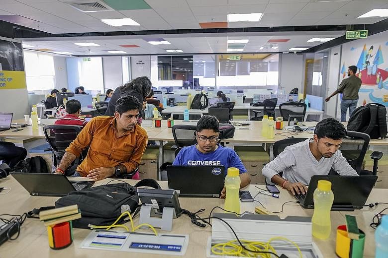 Employees at e-commerce company Flipkart Online Services in Bengaluru. India's IT services industry is worth $204.2 billion and employs nearly four million workers. But growing protectionism in the West, coupled with technologies such as artificial i