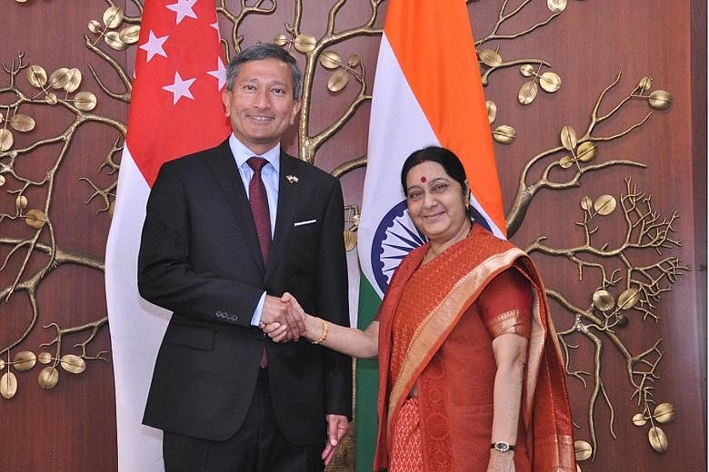 Dr Vivian Balakrishnan being welcomed by Ms Sushma Swaraj. Both ministers yesterday reviewed cooperation in defence and trade, among other areas.