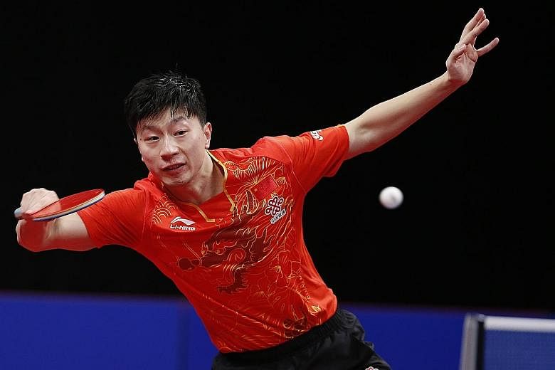 Ma Long in action at the Men's World Cup in Liege, Belgium last month. He and team-mates Fan Zhendong and Xu Xin were each fined US$20,000 (S$27,250) for quitting a tournament in Chengdu in June to protest against the redesignation of their coach.