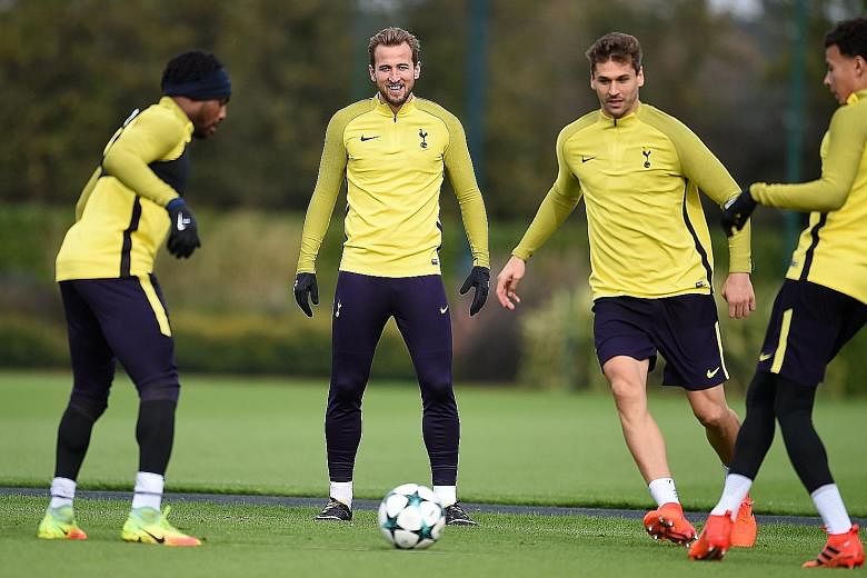 Tottenham striker Harry Kane (centre) in training with his team-mates. Spurs have not beaten European champions Real Madrid in five previous attempts and they will need Kane, who was badly missed at Old Trafford as Spurs slumped to a 1-0 defeat by Ma