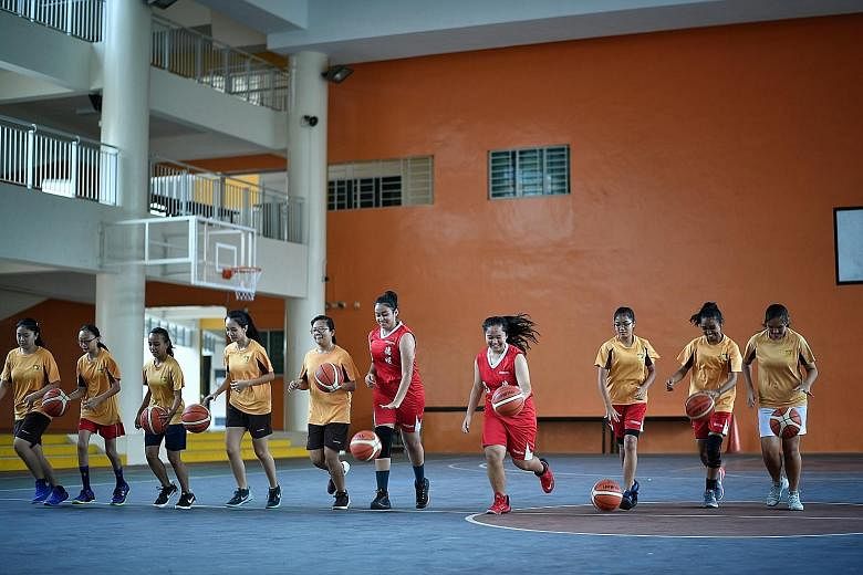 Jurong Secondary School's basketball teams are made up of students from different races. Observers said the mindset that some sports are associated with specific ethnic groups still persists, and it is important that parents do not just impose their 