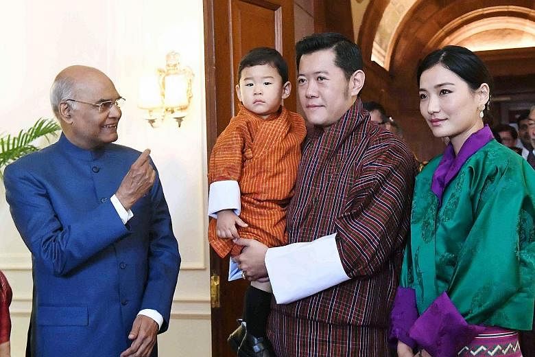 Indian President Ram Nath Kovind (far left) is shown meeting Bhutan's King Jigme Khesar Namgyel Wangchuck, Queen Jetsun Pema and Prince Jigme Namgyel at Rashtrapati Bhavan in New Delhi in a photograph released by the President's office yesterday. The