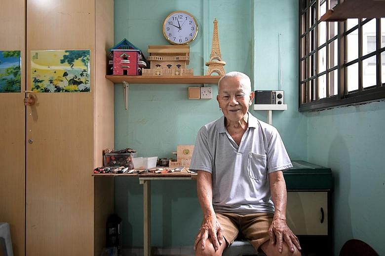 Mr Sum takes about three to four months to build a miniature house from plywood. So far, he has built more than 10 houses and sold a few for over $100 each. To pass time, retired carpenter Sum Kin Nar started building miniature houses about 10 years 