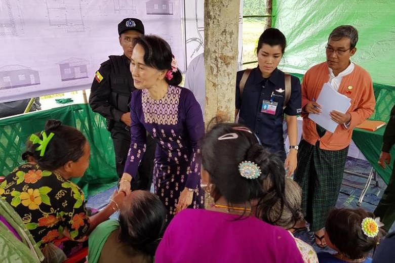 Aung San Suu Kyi urges people not to quarrel on first visit to