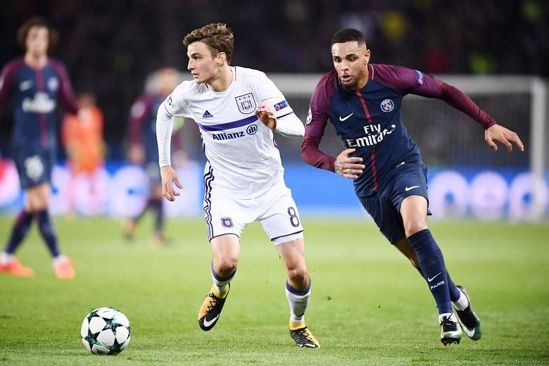 PSG left-back Layvin Kurzawa (right) outpacing Anderlecht midfielder Pieter Gerkens. He is the first defender to score a hat-trick in the Champions League.