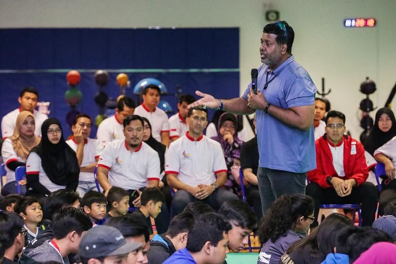Singapore Silat Federation chief executive officer Sheik Alau'ddin addressing over 300 parents and young athletes at a sharing session at the OCBC Arena last night on how to bring more success to the sport.