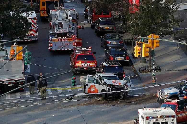 Emergency personnel at the scene of the deadly terror attack in New York that left eight people dead on Tuesday.