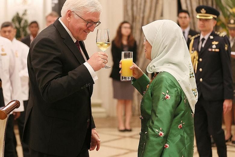 President Halimah Yacob with German President Frank-Walter Steinmeier at the Istana yesterday. Dr Steinmeier is in Singapore for a two-day state visit - the first by a German head of state - that ends today.