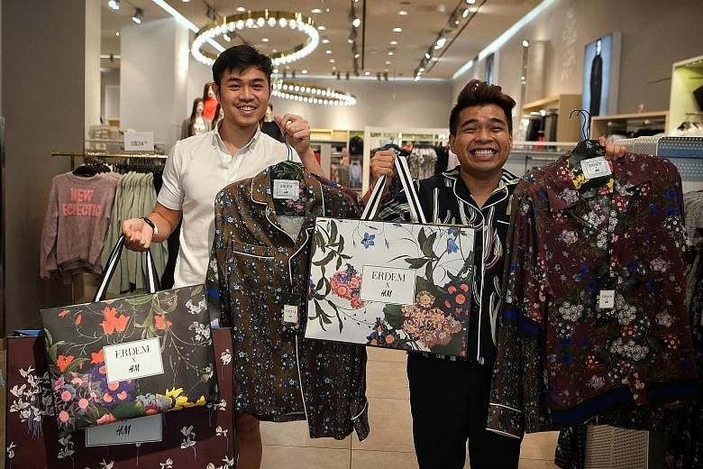 Mr Afif Barker (left) spent $785 on his purchases, while Mr Diniy D. Hamzah spent $512 on his. By 8am yesterday, there were 120 people in line at H&M's Orchard Building outlet.
