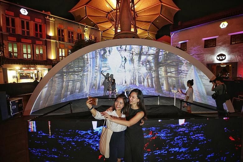 This year's Singapore River Festival will feature a Lit Up Party, an outdoor light-projection rave in Clarke Quay. The festival, which starts today and runs until tomorrow evening, involves more than 100 businesses in the area and is expected to draw