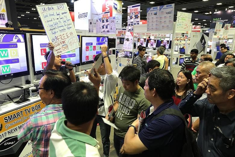 Visitors to this year's Consumer Electronics Fair are eligible for a lucky dip with no minimum spending required. The event at Suntec Convention and Exhibition Centre is on till tomorrow.
