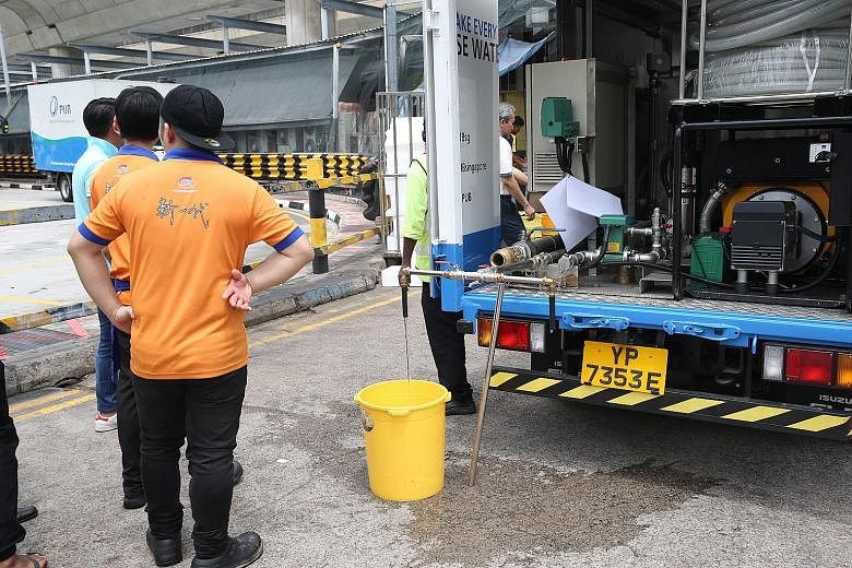 Clockwise from far left: A water pipe leak within a construction site at the junction of Tampines Avenue 5 and Tampines Central 2 yesterday affected water supply to the bus interchange and food stores in the area; food and beverage staff collecting w