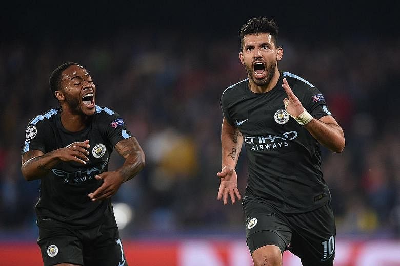 Manchester City's Sergio Aguero (right) celebrating with Raheem Sterling after scoring his record 178th goal for the club during the 4-2 Champions League win against Napoli on Wednesday.
